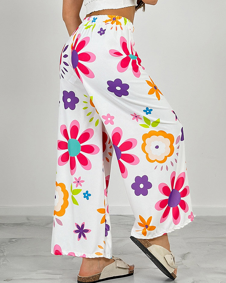 Royalfashion Naiste laiad lillemustrilised riidest püksid