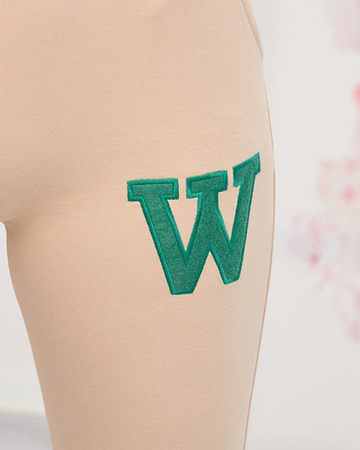 Women's beige sweatpants with a colored patch - Clothing
