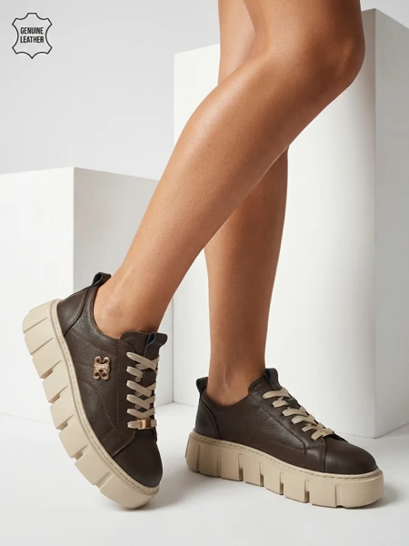 Спортивные женские кроссовки из натуральной кожи Taures