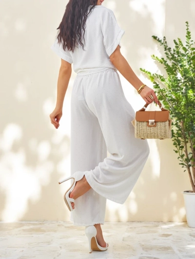 Royalfashion Naiste komplekt lipsuga lühikeste varrukatega särgist ja laienevatest pükstest, millel on seisukindlad kivid