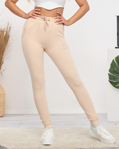 Light beige women's sweatpants with cubic zirconia - Clothing