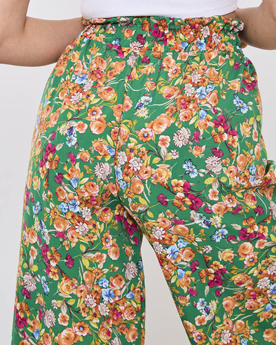 Naiste rohelised palazzo püksid oranžide lilledega- Rõivad