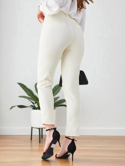 Royalfashion Naiste treggings dekoratiivsete nööpidega