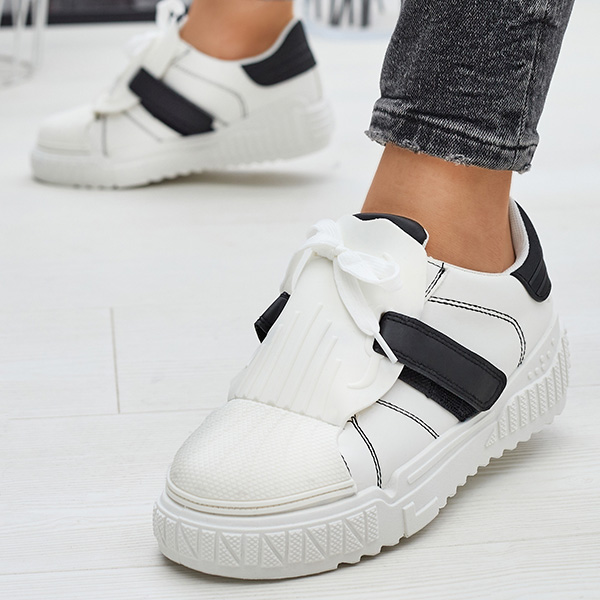 Mustad ja valged naiste spordijalatsid kummist sisetaldadega Inika - Jalatsid