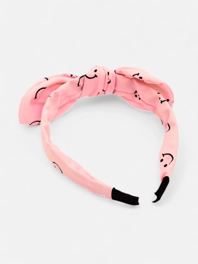 Royalfashion Children's headband with a bow with a print of smiling faces