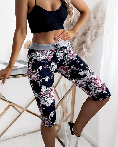 Lillelised 3/4 naiste lühikesed püksid tumesinise ja korallvärviga PLUSS SUURUS - Riietus