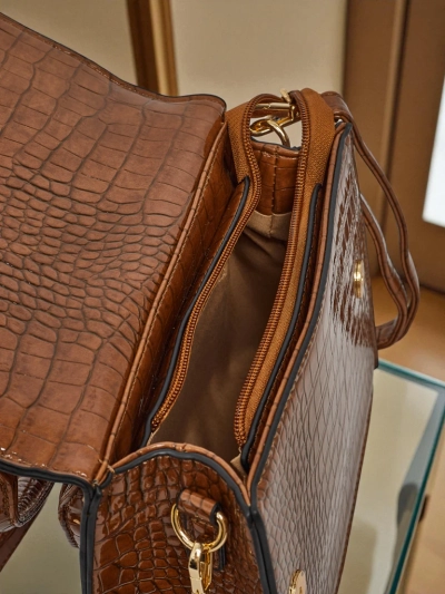 Lakitud väike naiste ökonahast käekott Veluna