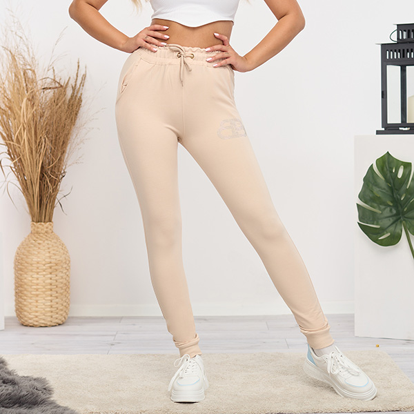 Light beige women's sweatpants with cubic zirconia - Clothing