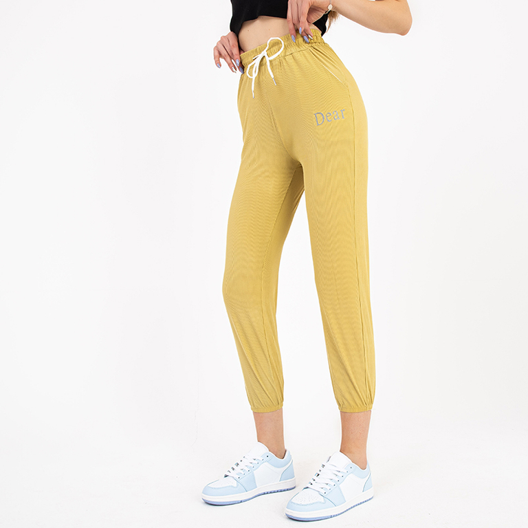Yellow women's fabric pants with a patch - Clothing