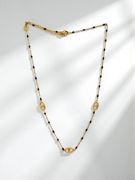 Gold-plated Aurelia Nero necklace with antique motif and black beads