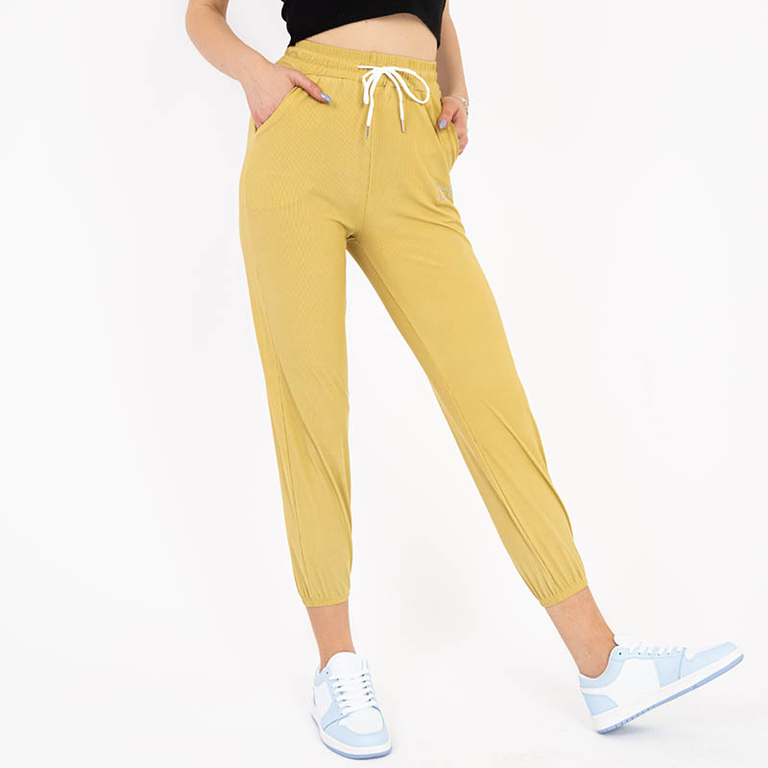 Yellow women's fabric pants with a patch - Clothing