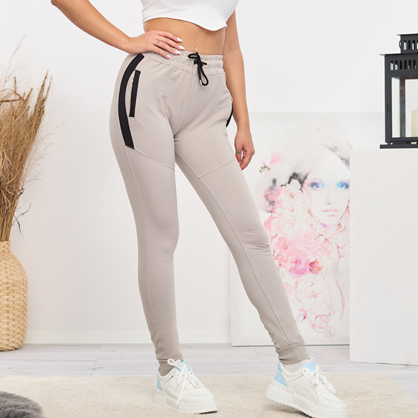 Naiste helehallid vahetükkidega dressipüksid- Riietus