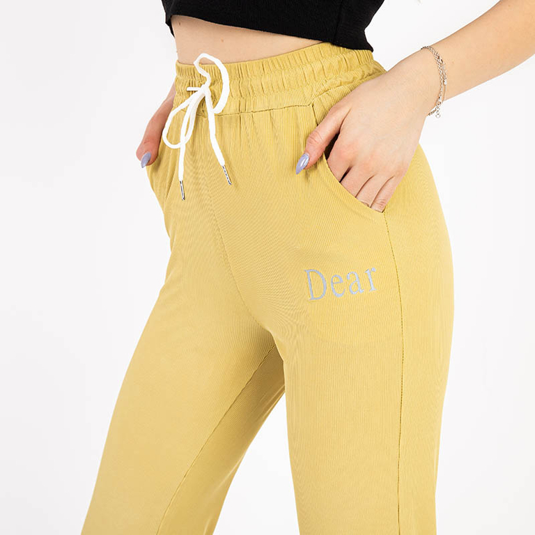 Yellow women's fabric pants with a patch - Clothing