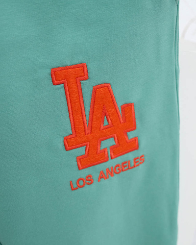 Women's green sweatpants with a colored patch - Clothing