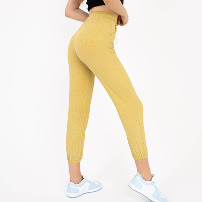 Yellow women's fabric pants with a patch - Clothing