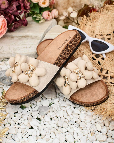 Royalfashion Naiste flip-flops kuldsete karude ja lilledega Isaralle