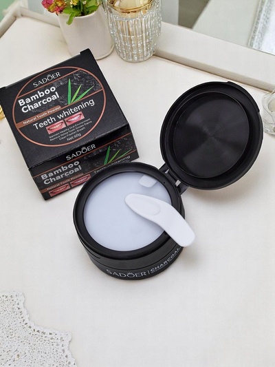 Sadoer Whitening tooth powder removing stains from coffee, tea, and tobacco