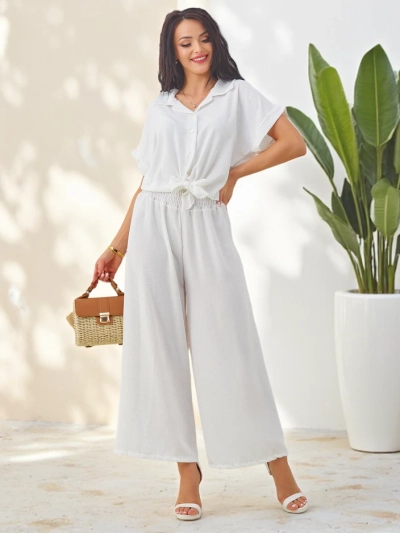 Royalfashion Naiste komplekt lipsuga lühikeste varrukatega särgist ja laienevatest pükstest, millel on seisukindlad kivid