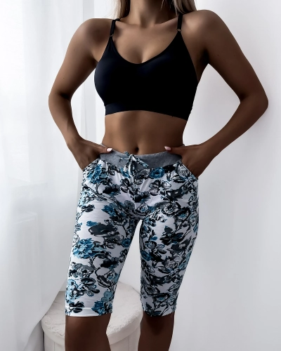 Naiste valged ja lillelised 3/4 lühikesed püksid PLUSS SUURUS - Riietus