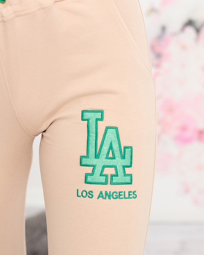 Women's beige sweatpants with a colored patch - Clothing