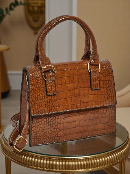 Lakitud väike naiste ökonahast käekott Veluna