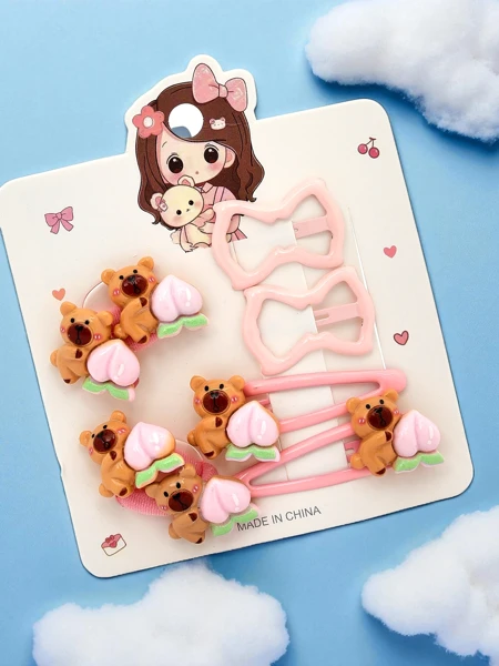 Hair clip set with teddy bear and bow motifs