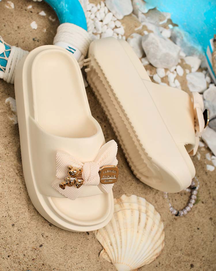 Royalfashion Naiste kummist flip-flopid dekoratiivse vibuga Nilm