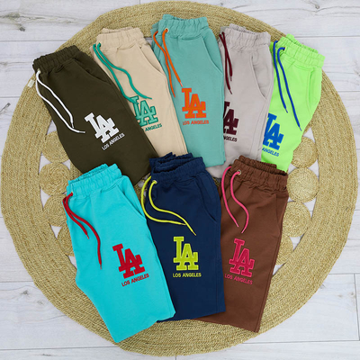 Women's green sweatpants with a colored patch - Clothing